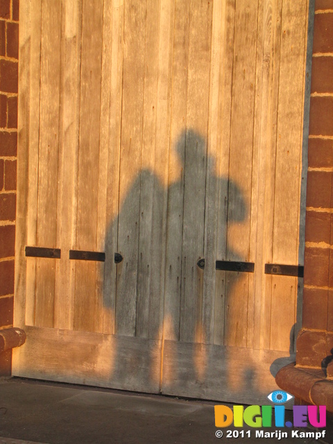 SX17393 Shadow of Jenni and Marijn on door of St. Davids Cathedral